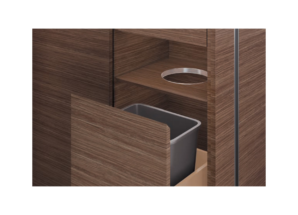 Wood office furniture from OFS provides practical support. The unit features a wastebasket below.