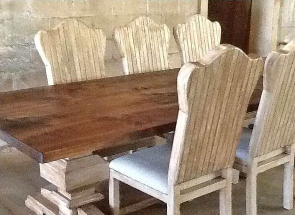 Rustic rectangular dining table view with chairs