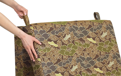Simple pull straps on the back of the chair sleeper bed allow for an easy conversion back to a sitting position