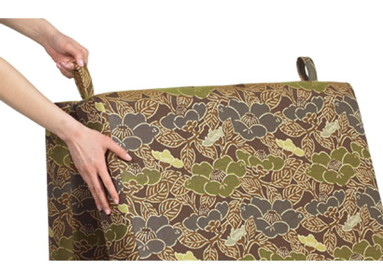 Simple pull straps on the back of the chair sleeper bed allow for an easy conversion back to a sitting position