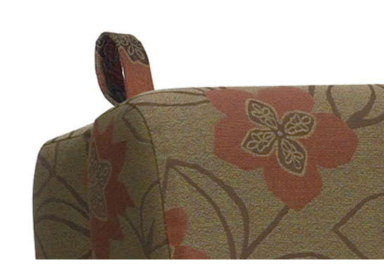 Two soft flexible handles are provided on the back of chair sleepers to return the sleeping platform to a sitting position.
